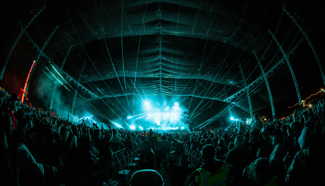 Fans under the blue LED lights of the Chevron Stage at Reading Festival