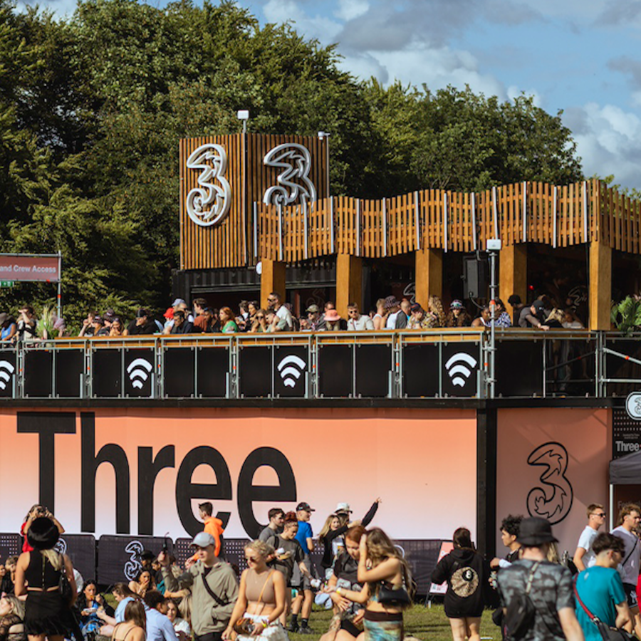 customers standing on the Three viewing platform at Reading Festival 